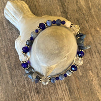 A bracelet made of Lapis round beads with crystals & sodolite chips