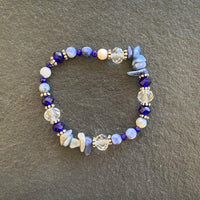 A bracelet made of Lapis round beads with crystals & sodolite chips