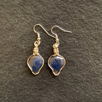 Earrings made of Rose Cut Blue Sapphires in silver wrap