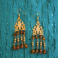 Earrings made of Tortoise Crystals with gold beads & chandelier base