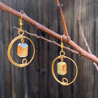Earrings made of Rectangular Faceted Crystals in gold wrapped hoop