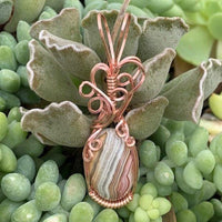Pendant made of Crazy Lace Agate with Rose Gold Wrap; 5/8" w x 2 1/8" h, incl bail