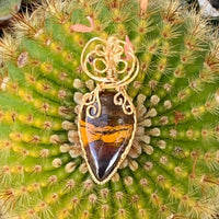 Pendant made of Natural Desert Jasper Teardrop stone with gold wire wrap; 7/8" w x 2" long, incl bail
