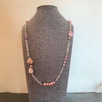 A necklace made of Botswana Pink Agates with pink pearls & rose quartz on silver chain