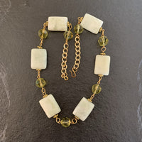 A necklace made of Harmony Jasper rectangles with Green crystals on gold chain