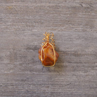 Pendant made of Large freeform Orange Carnelian w/ gold wrap; 1.5" x 2.5" incl bail