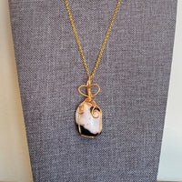 Pendant made of Small Black & White Jasper stone w/ gold wrap; .78" x 1.78" incl bail