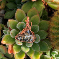Pendant made of Ocean jasper triangular stone with copper wrap; 1.5" w x 1 7/8" h incl bail