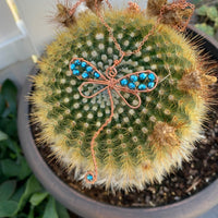 Pendant made of Dragonfly shaped copper wire with turquoise crystals; 2 1/8" w x 3 3/8" h incl bail