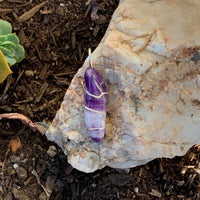 Pendant made of Chevron Amethyst long nugget with silver wrap; 1/2" w x 1 7/8" h, incl bail