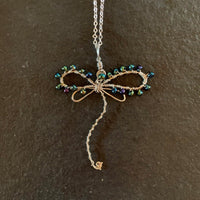 Pendant made of Dragonfly shaped copper wire with with turquoise seed beads; 2.25" w x 2.75" h, incl bail