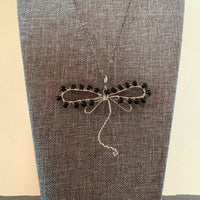 Pendant made of Dragonfly shaped wire with black seed beads; 3" w x 2.5" h, incl bail