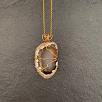 Pendant made of Brown, Black & White Agate oval Geode; 1.25" w x 2 3/8" h, incl bail