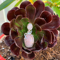 Pendant made of Double stone Rose Quartz with silver wrap; 3/4" w x 2.75" h, incl bail