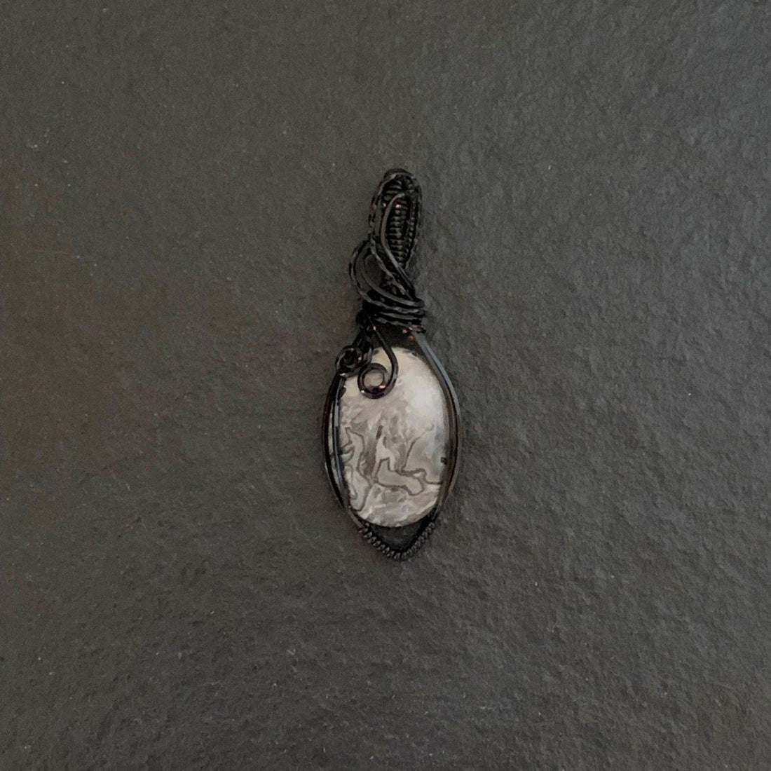 Pendant made of Black & White Crazy Lace Agate with Black wrap;.75" w x 2 1/8" h, incl bail; black cord 18" long with 1" extender included; total length 20 1/8" long