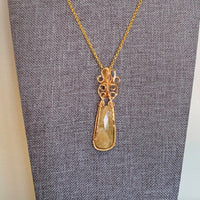 Pendant made of Yellow Sapphire stone with Gold Wrap; 5/8" w x 2.25" h, incl bail