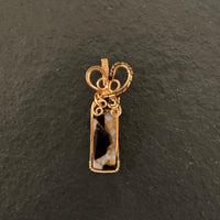 Pendant made of Ivory Copper Obsidian Rectangle with gold wire wrap and black accent; .5" w x 2" h, incl bail