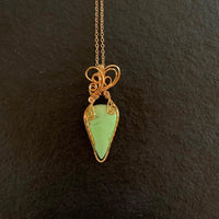 Pendant made of Lemon Chrysoprase Teardrop stone with gold wire wrap; .75" w x 2.25" l, incl bail