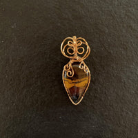 Pendant made of Natural Desert Jasper Teardrop stone with gold wire wrap; 7/8" w x 2" long, incl bail