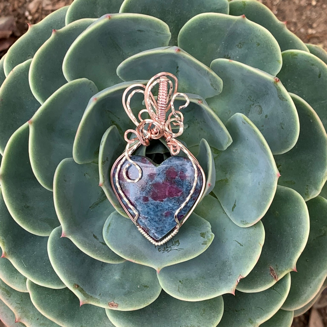 Ruby Kyanite Heart stone with silver & rose gold wire wrap; 1.25" w x 2.25" long incl bail