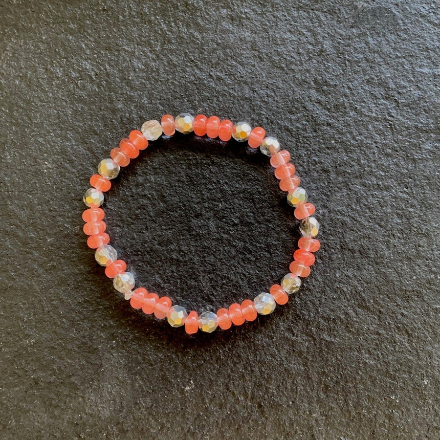 A bracelet made of Cherry Quartz rondels with silver crystals