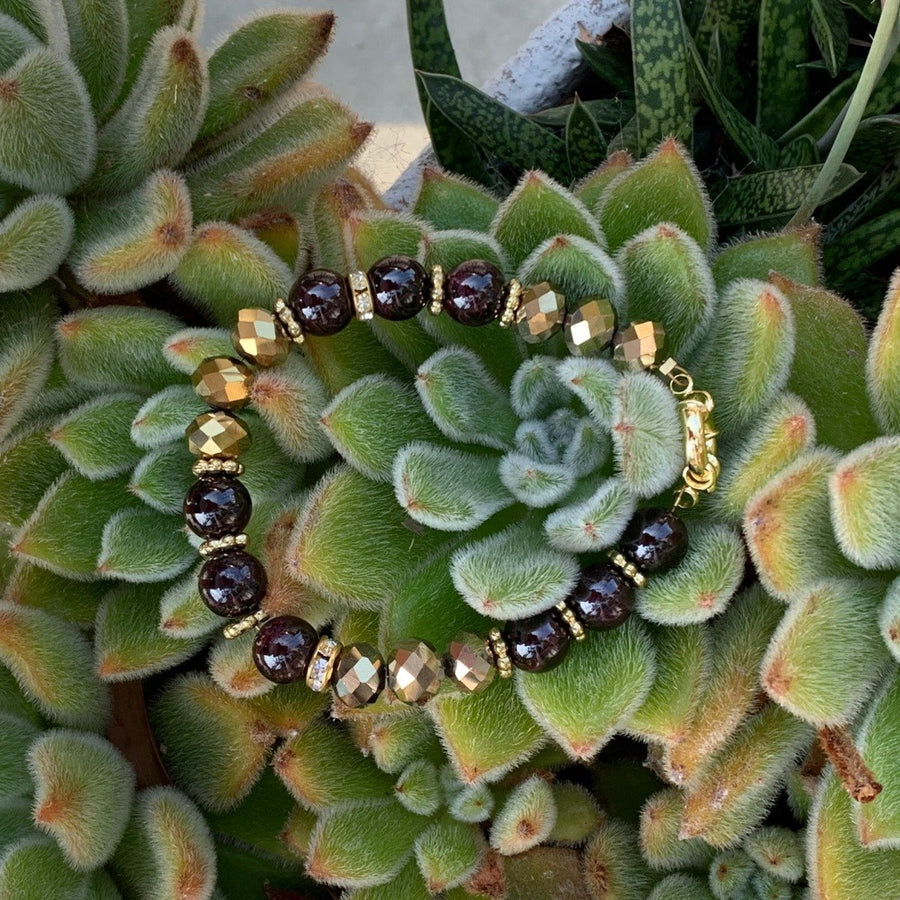 A bracelet made of Garnet beads & gold crystal rondels with magnetic clasp