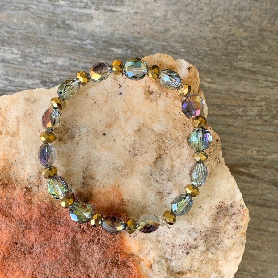 A bracelet made of Aurora coin crystals with gold rondels