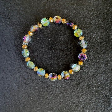 A bracelet made of Aurora coin crystals with gold rondels