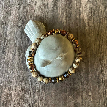 A bracelet made of Round Jasper with gold crystals & spacers