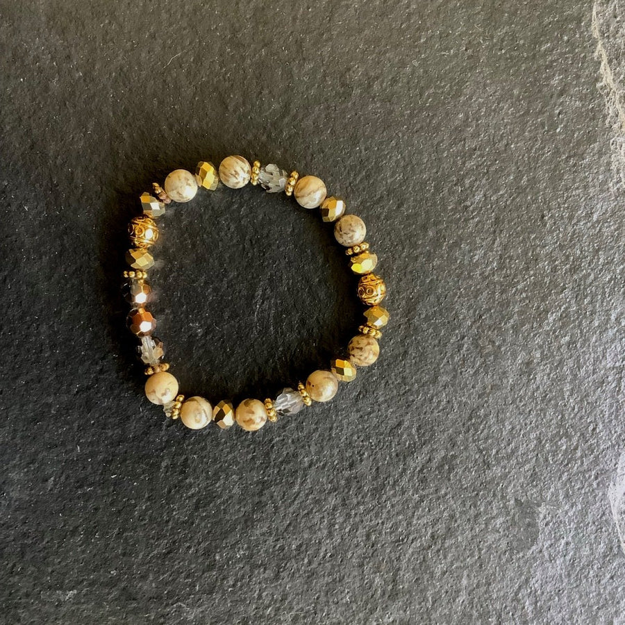 A bracelet made of Round Jasper with gold crystals & spacers