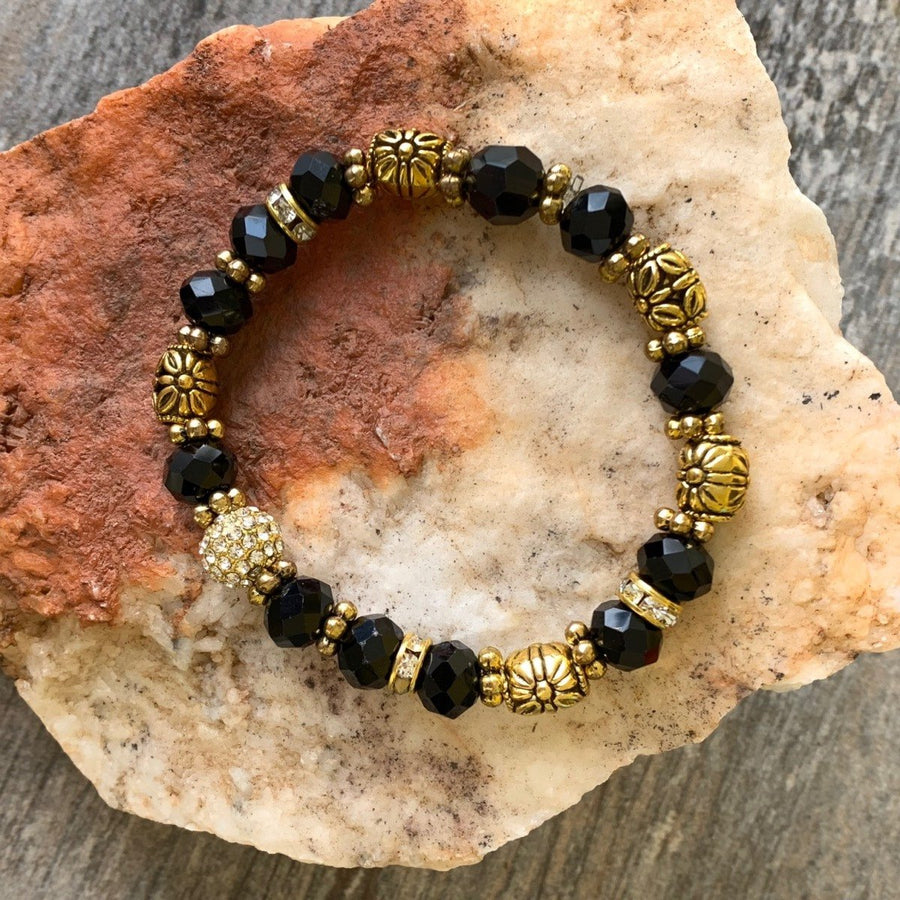 A bracelet made of Black crystal rondel with disco ball & barrel beads
