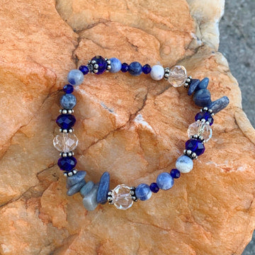 A bracelet made of Lapis round beads with crystals & sodolite chips