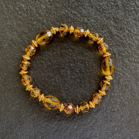 A bracelet made of Gold crystals with gold metal spacers on elastic