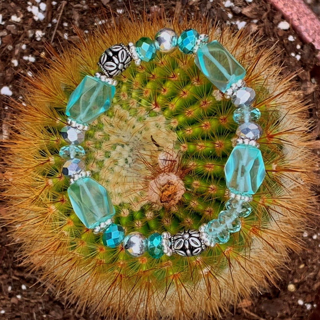 A bracelet made of Aqua Quartz rectangle barrels with silver crystals & beads