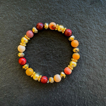 A bracelet made of Mookaite beads with gold beads and gold spacers