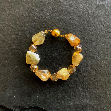 A bracelet made of Citrine quartz nuggets with gold crystals & magnetic clasp