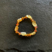 A bracelet made of Citrine quartz nuggets with crystals rondels on elastic