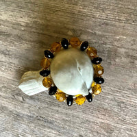 A bracelet made of Gold Crystal round with large black onyx rondels