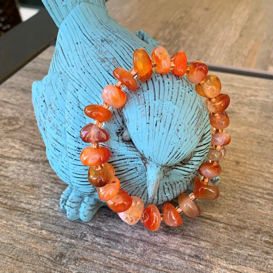 A bracelet made of Carnelian Chips with seed beads on elastic