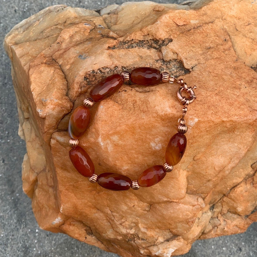 A bracelet made of Fire Agates & carnelian nuggets w/ Copper beads & spring clasp