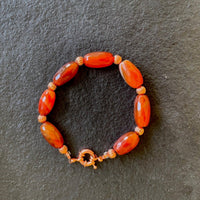 A bracelet made of Fire Agates & carnelian nuggets w/ Copper beads & spring clasp