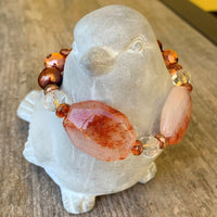 A bracelet made of Carnelian Dendritic rectangles with copper disco beads & copper pearls with spring clasp