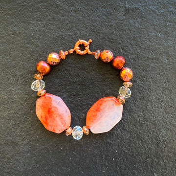 A bracelet made of Carnelian Dendritic rectangles with copper disco beads & copper pearls with spring clasp