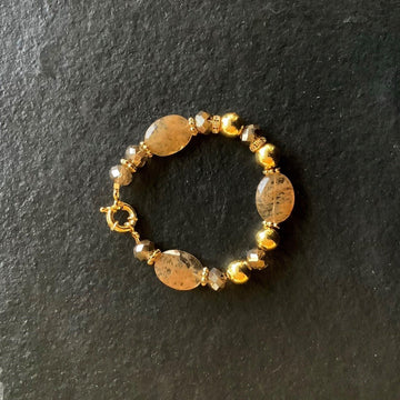 A bracelet made of Large oval faceted Gold Dendritic Agates with crystal rondels & spring clasp