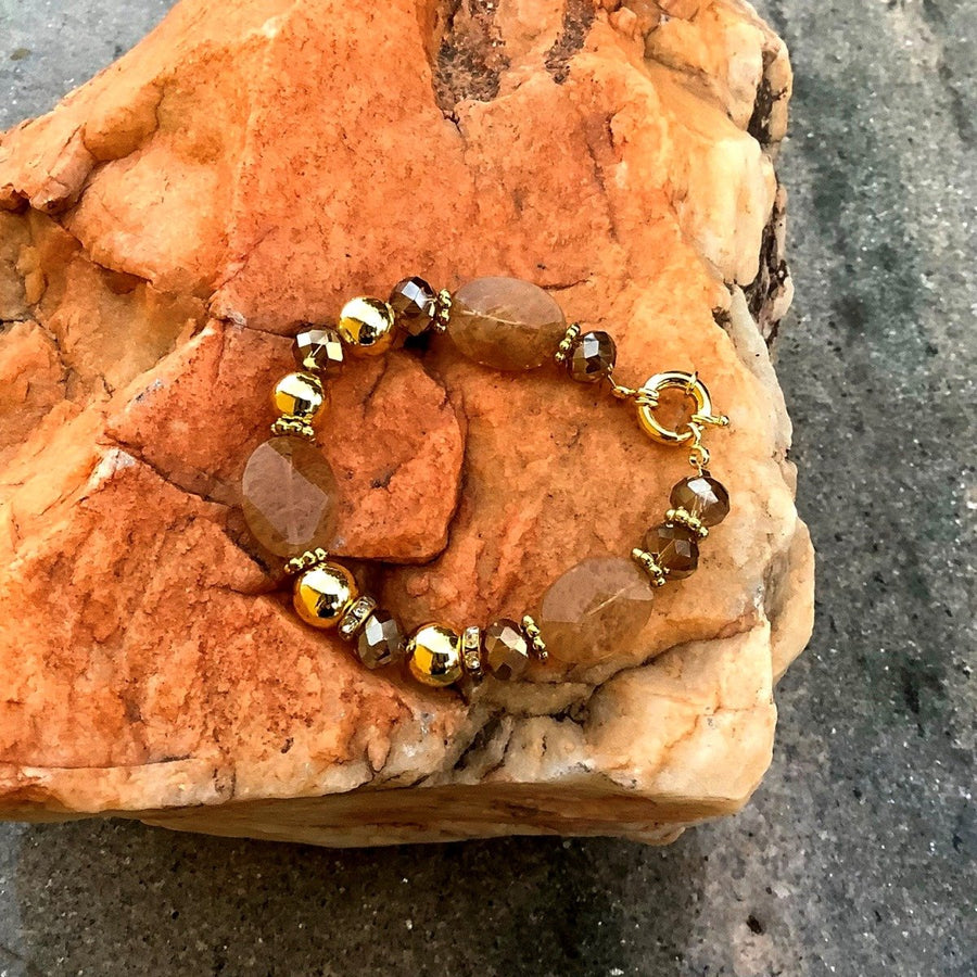 A bracelet made of Large oval faceted Gold Dendritic Agates with crystal rondels, Gold beads & spring clasp