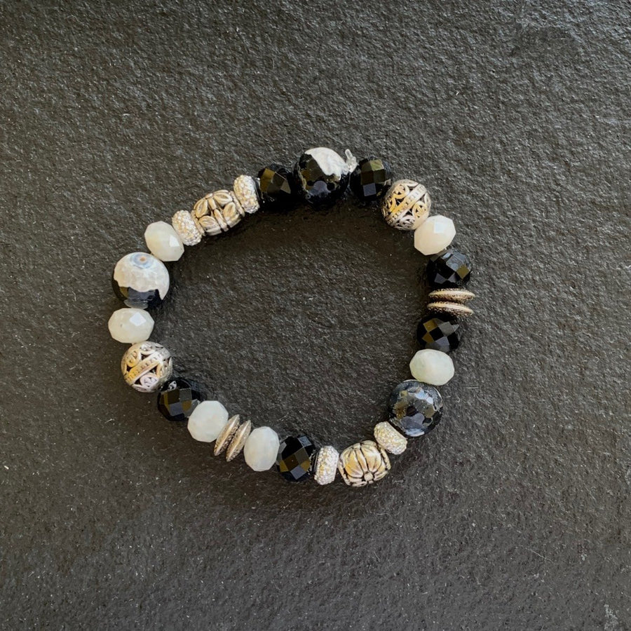 A bracelet made of Zebra Jasper with b&w rondels and silver beads on elastic