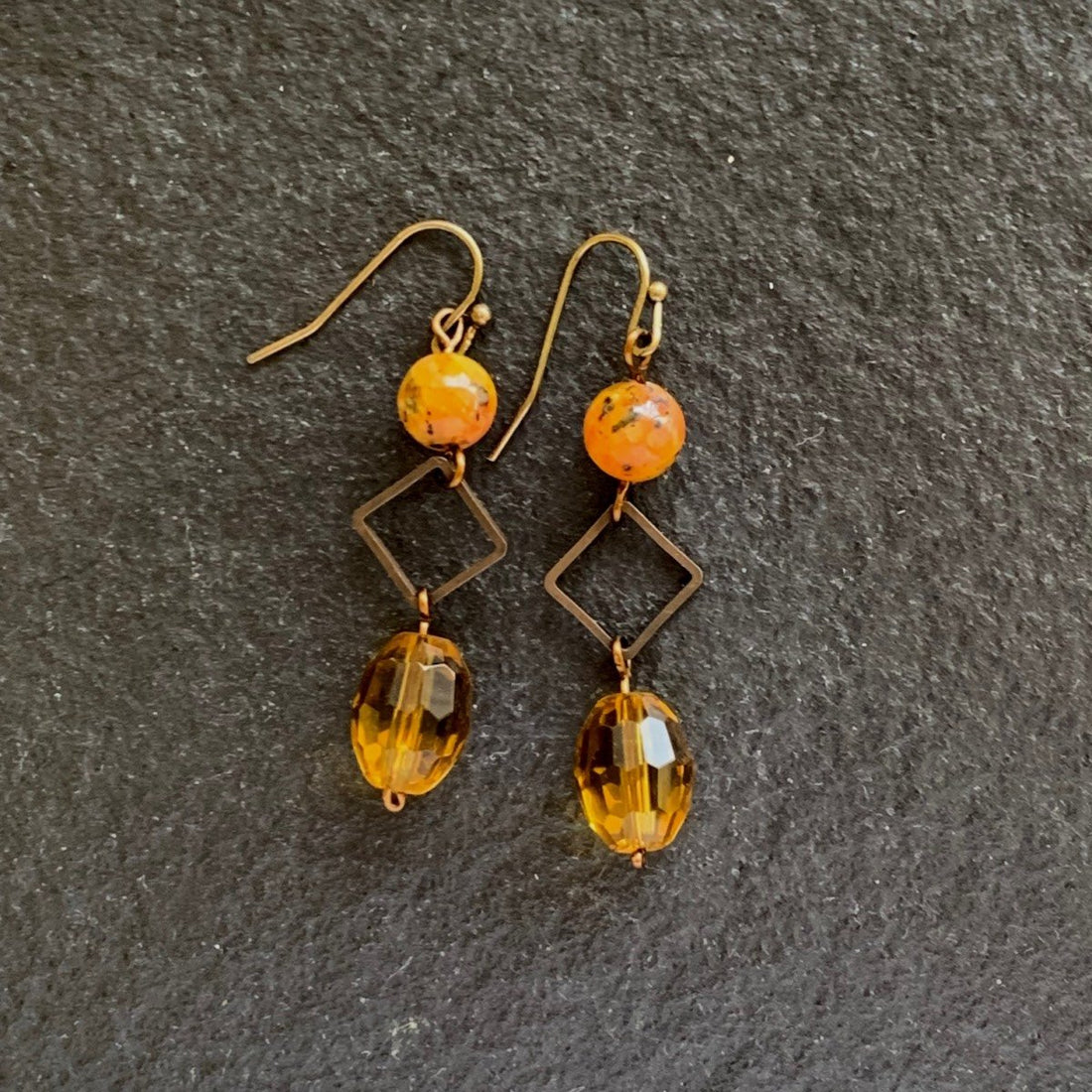 Earrings made of Orange fancy jasper with square bronze accents & gold crystals
