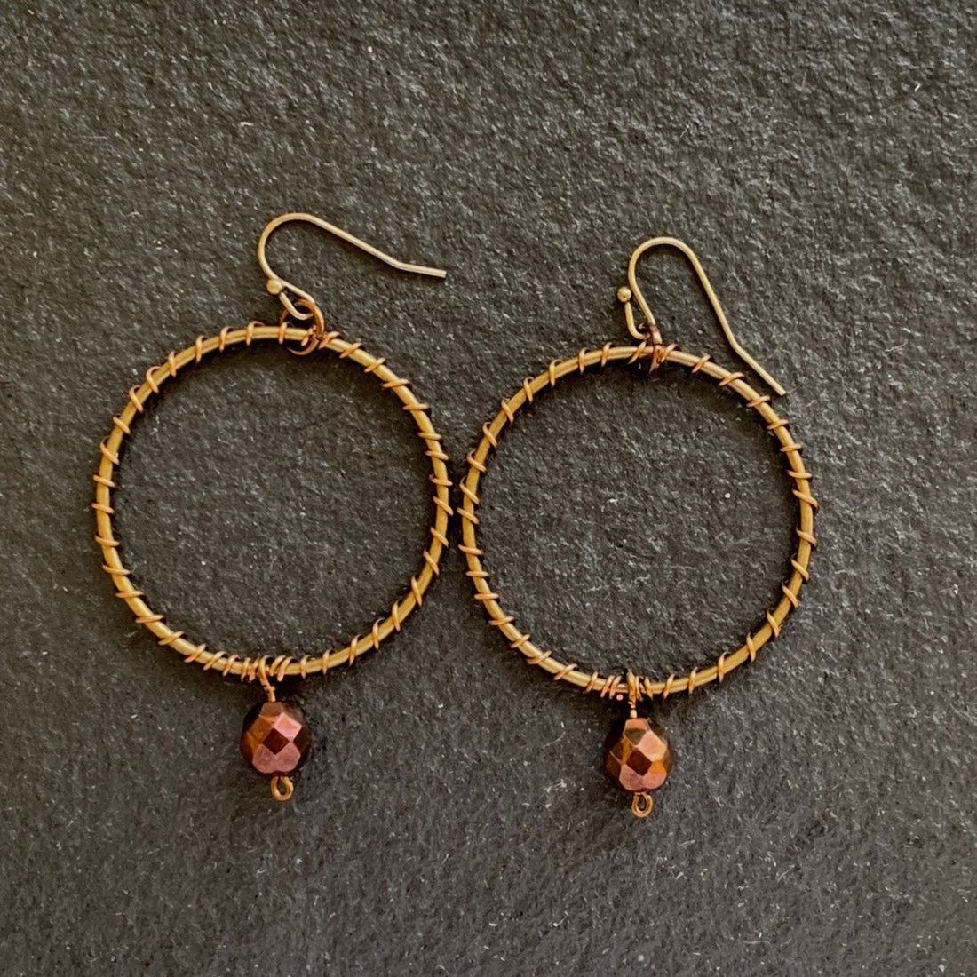 Earrings made of Bronze wire wrapped hoops with crystal drop