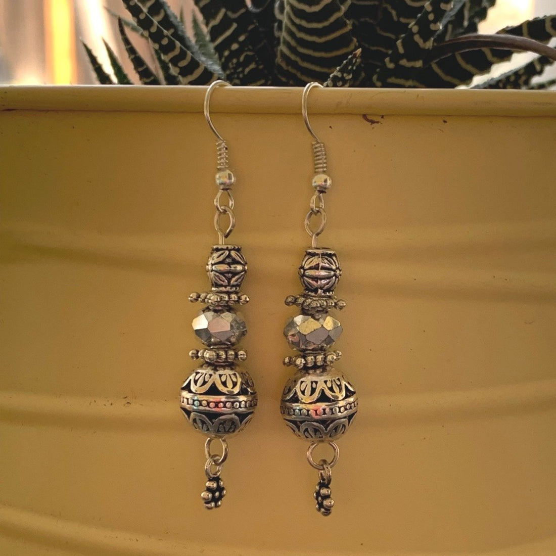 Earrings made of Antique silver round beads with crystal rondels