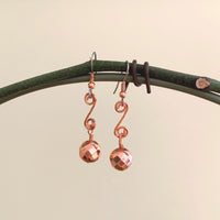 Earrings made of Copper Disco beads on scrolled copper wire